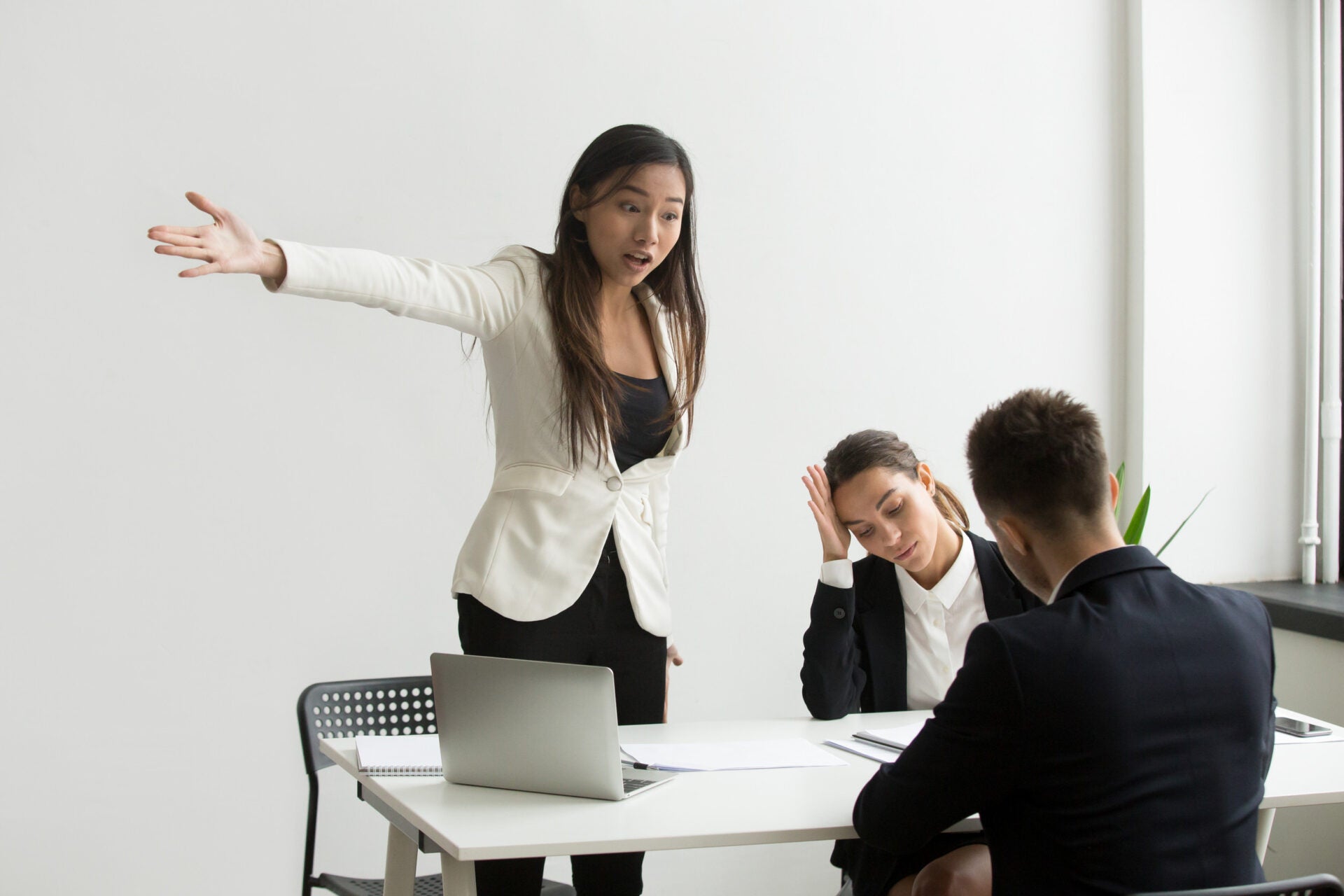 hr pointing door angry employee 123rf