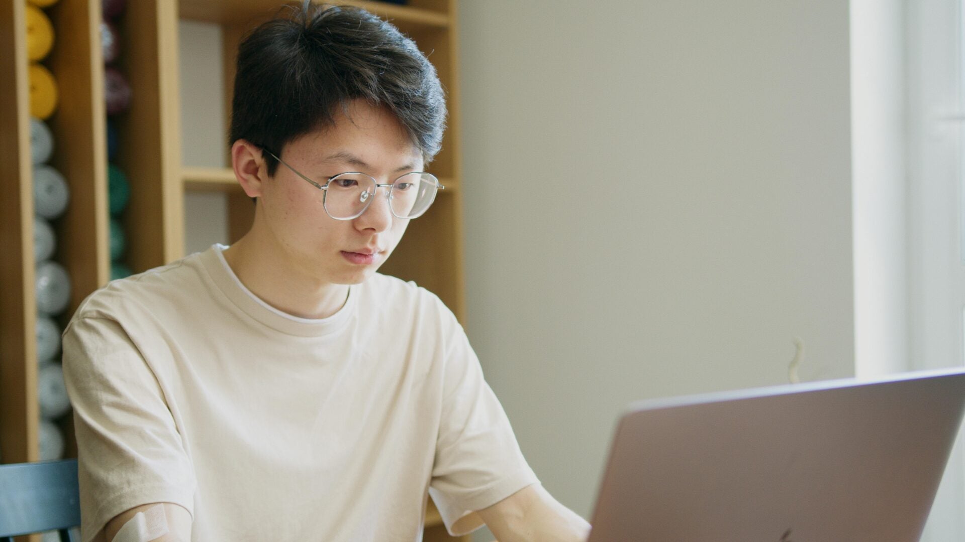 pexels artempodrez man using laptop asian