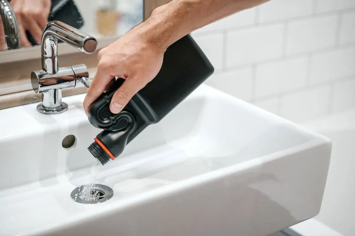 pouring sink drain declogger chemical