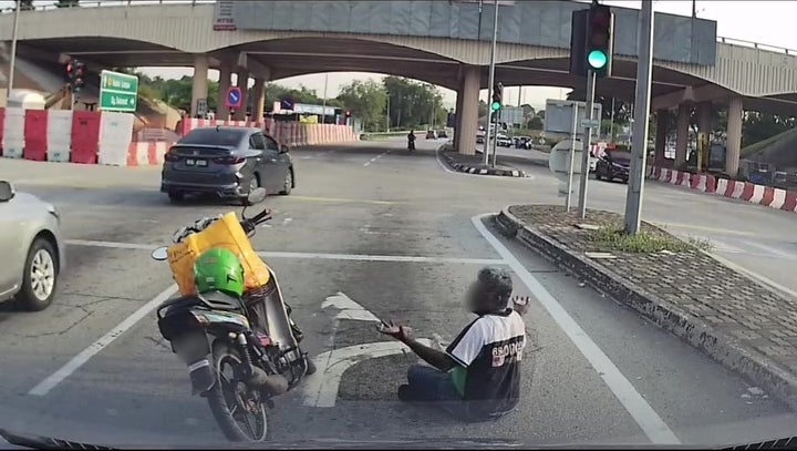 man sit middle of road rest smoke 13 1