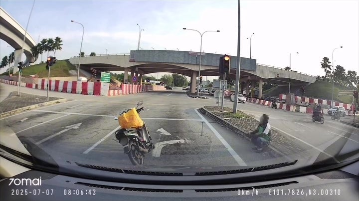 man sit middle of road rest smoke 7 1