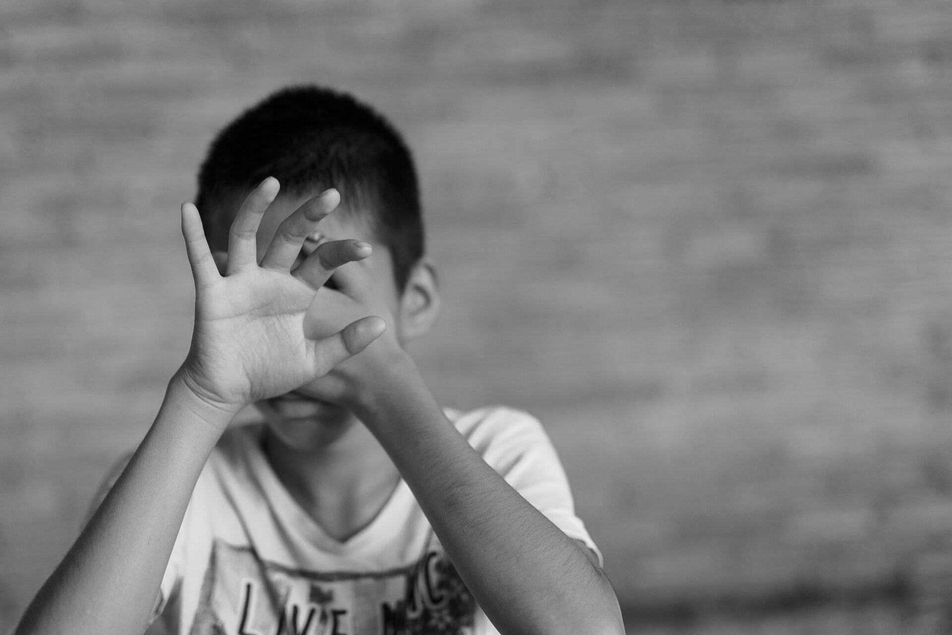 boy bully cover face 123rf