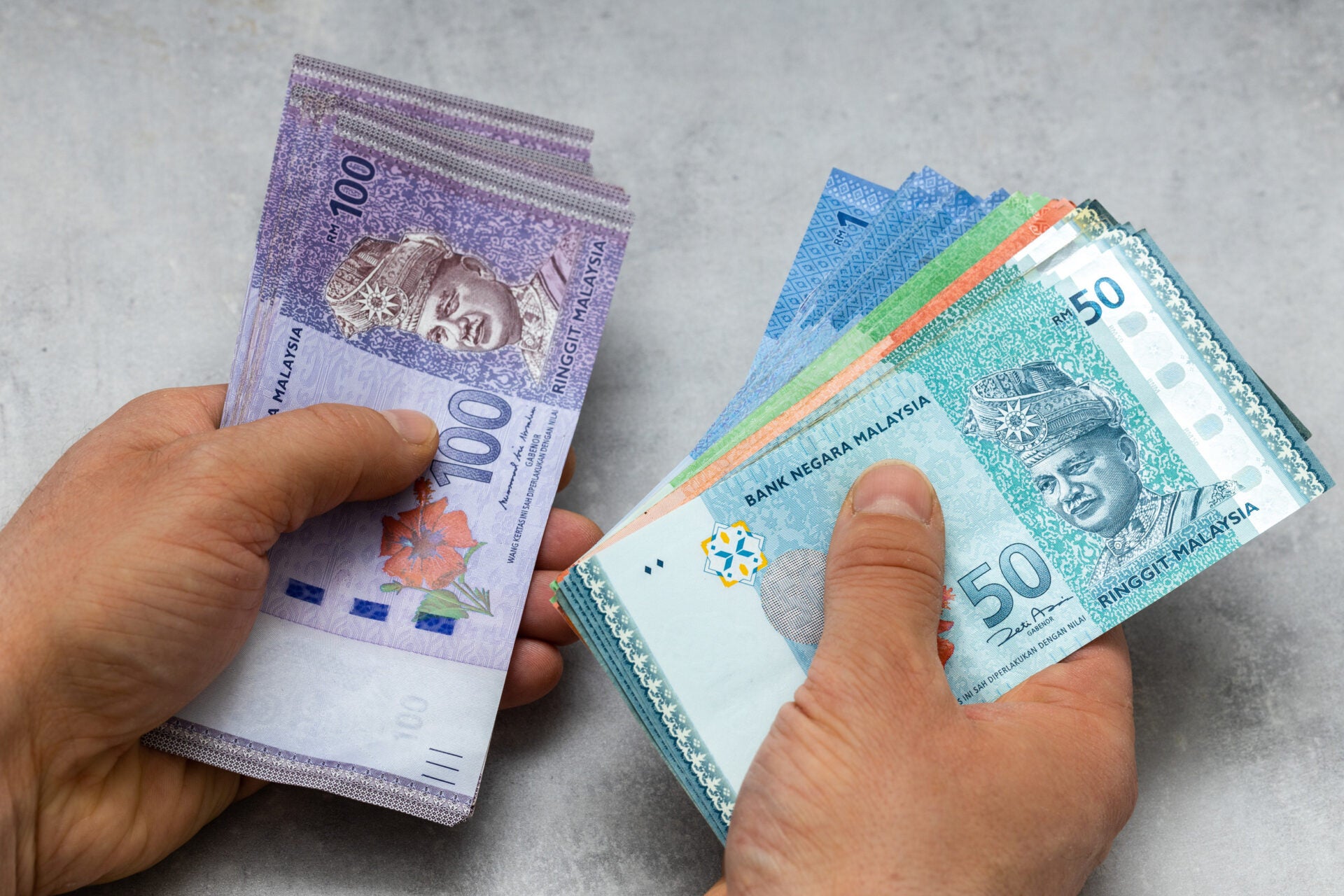 man hand counting money cash malaysian ringgit 123rf