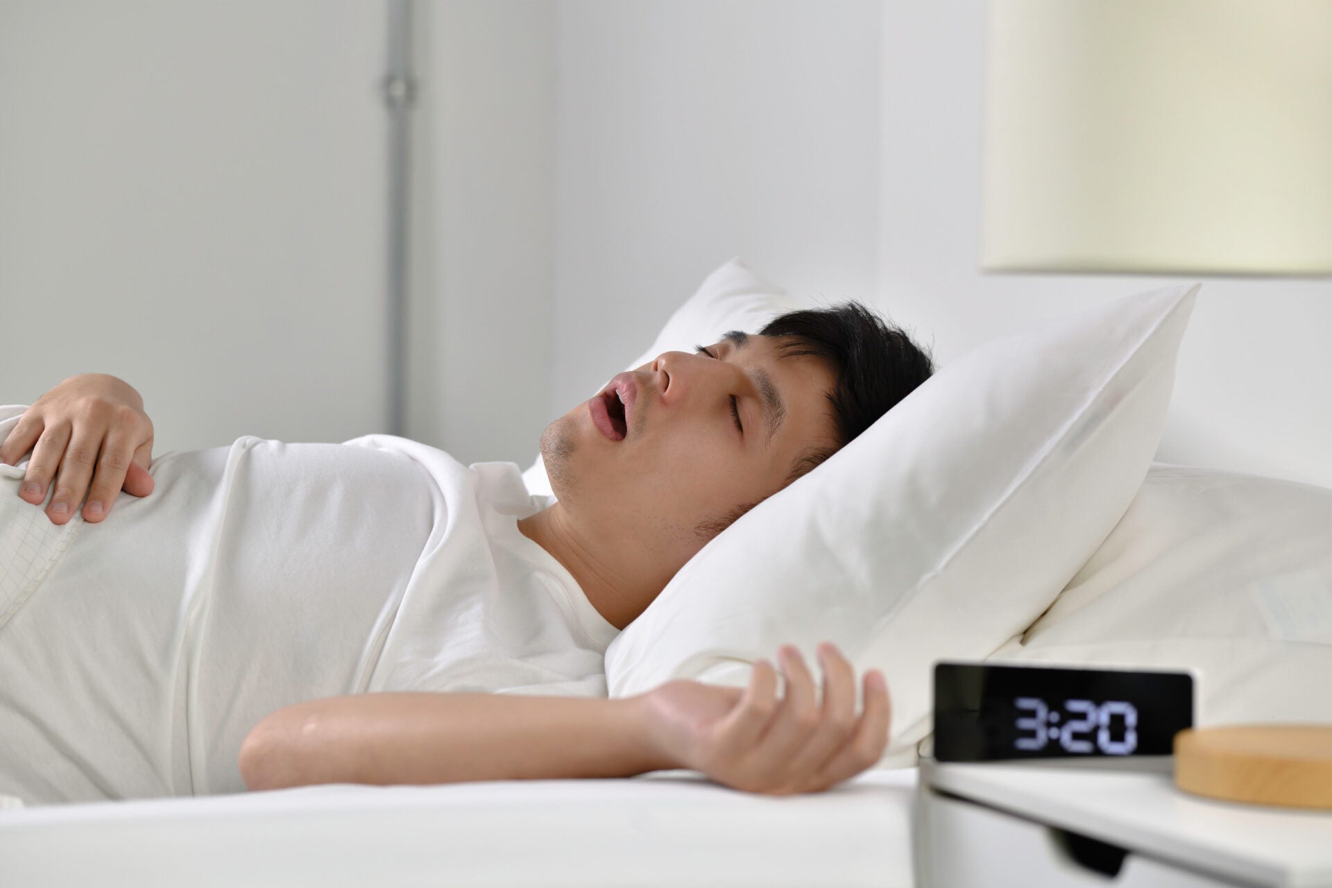 man sleeping snoring bed 123rf