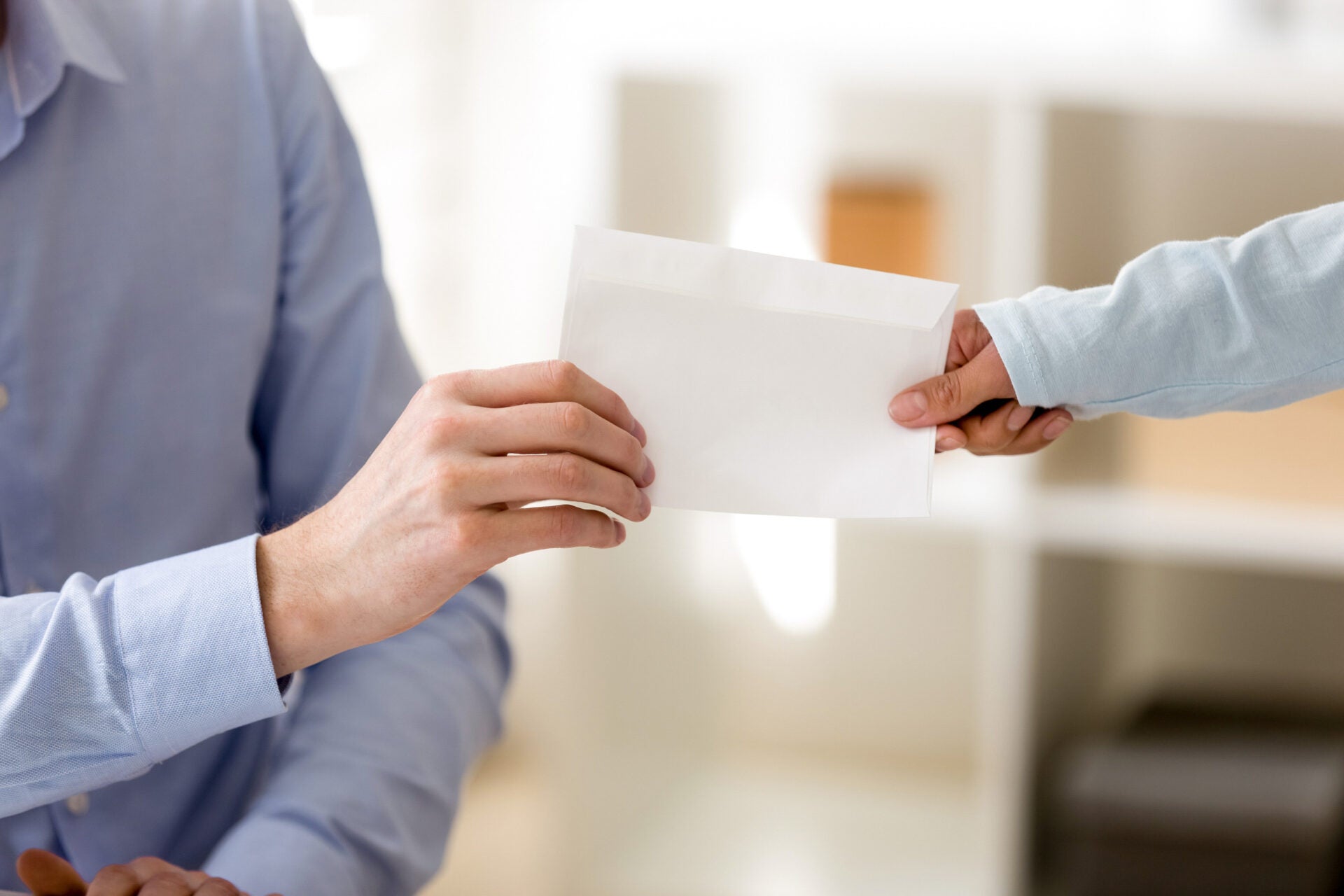 handing envelope salary 123rf