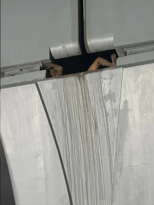 man steal cable stuck between mrt pole