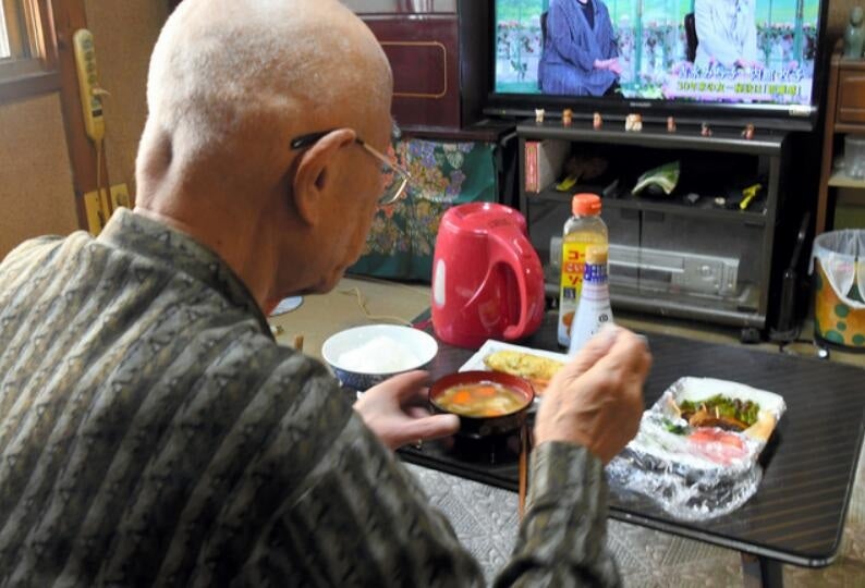 retired senior man eating