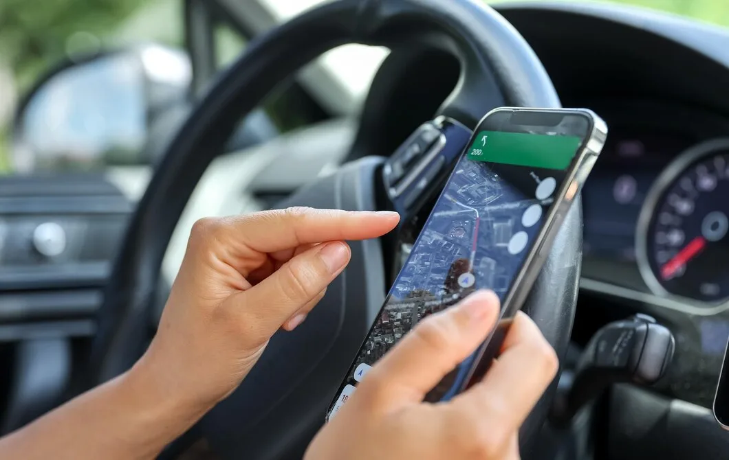 Female Driver Hand Holding Phone With Interface Navigator Screen 169016 38729