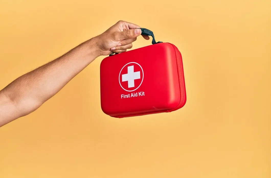 Hand Hispanic Man Holding First Aid Kit Isolated Yellow Background 839833 12895