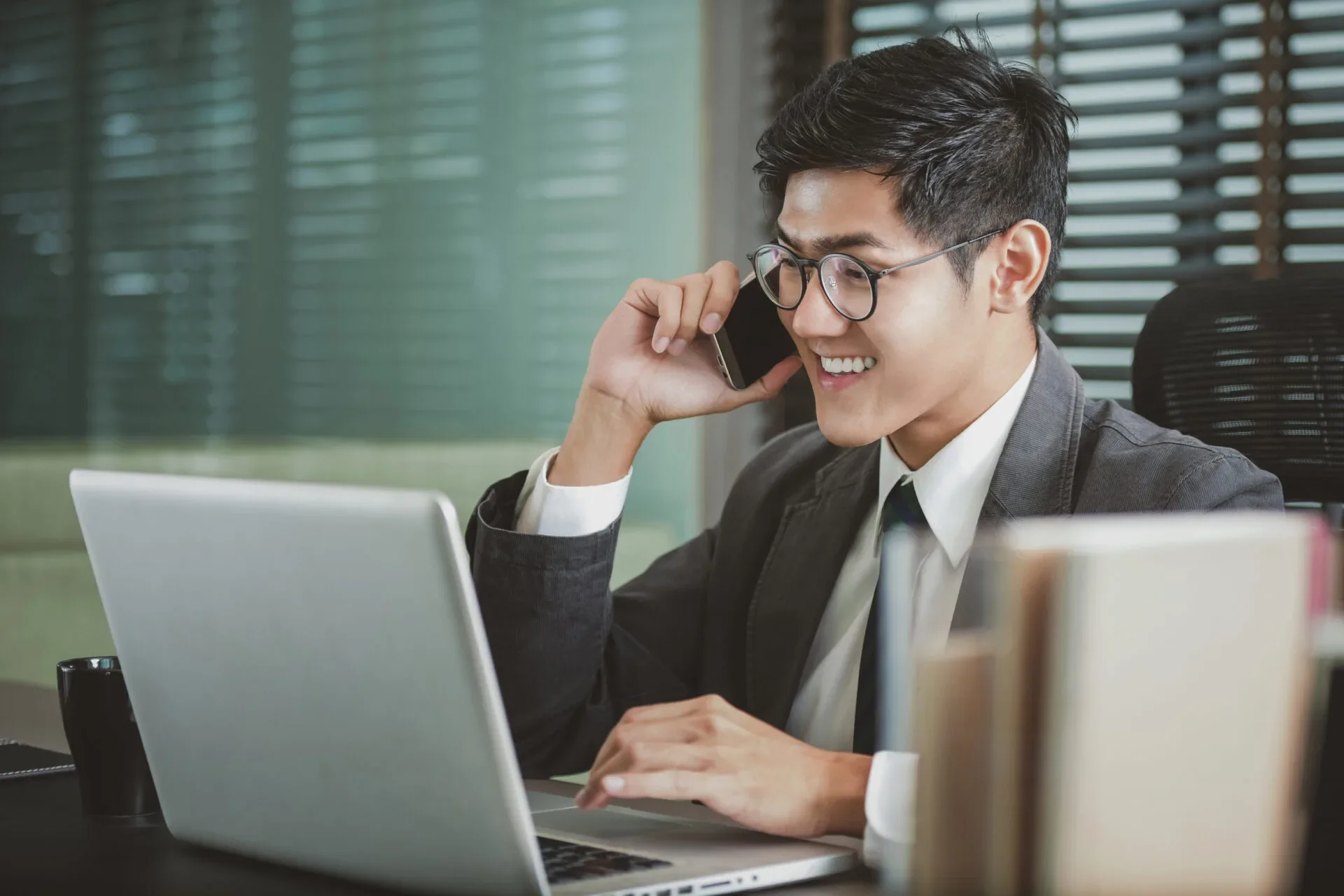 Asian Man Working Laptop Phone Call 123Rf