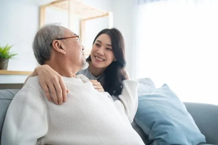 Asian Lovely Family Young Daughter Greeting Hugging Older Father Attractive Woman Granddaughter Visit Senior Elder Mature Man House Enjoy Spend Leisure Time To