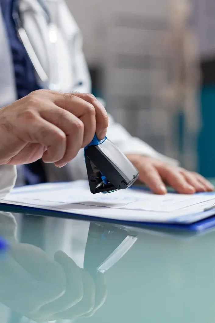 Doctor Holding Medical Stamp Put Prescription Paper Health Care Exam Hand Physician Putting Seal Checkup Report Giving Medicine Patient Consultation Close Up 482257