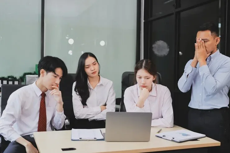 Frustrated Upset Multiracial Business Team People Sad With Bad Work Result Report Disappointed Corporate Bankruptcy Failure Crisis Worried Paperwork Problem Sit Table