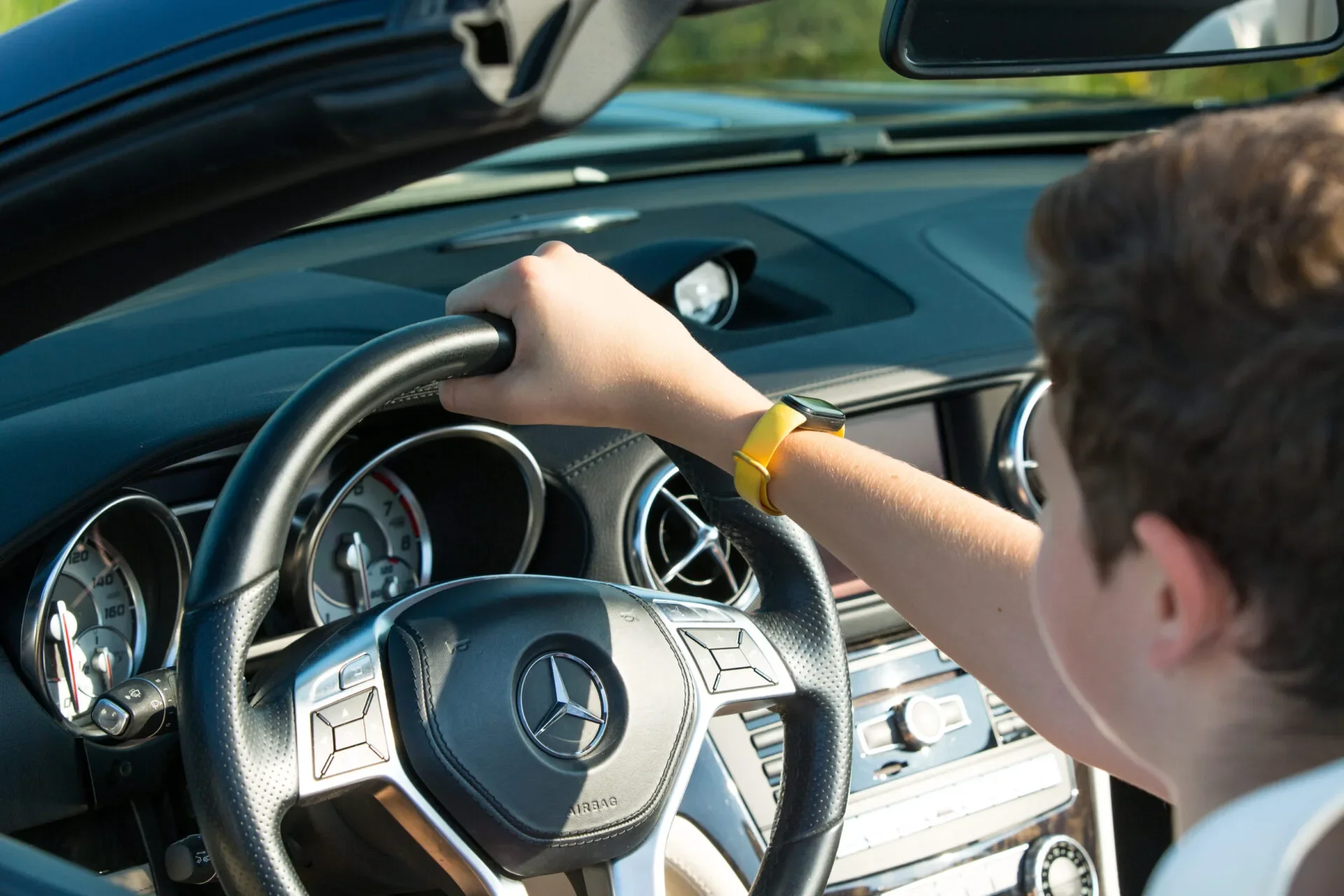 Closeup On Male Hands Driving Mercedes Benz Car Luxury Transportation Lifestyle. Mercedes Benz Sl550 Convertible On The Road 123Rf